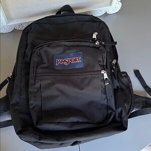Jansport Black Backpack with Navy Logo Patch